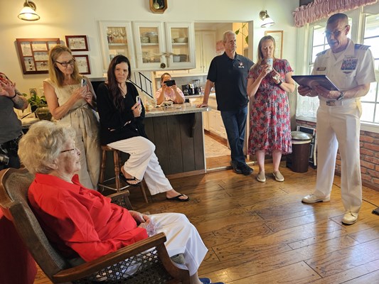VWC&#39;s Cmdr. Brian Wierzbicki presents a Certificate of Honor to Gold Star mother Virginia Kelly, as 